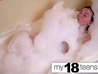 babe masturbates in the bath, reaching orgasm in closeup