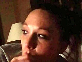 Wife with big tits intensely sucks cock in deep blowjob session.