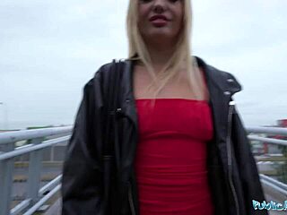 I spotted a skinny blonde in a red dress outdoors.