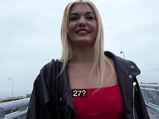 I spotted a skinny blonde in a red dress outdoors.