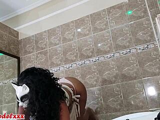 Ebony model poses with big tits in photoshoot