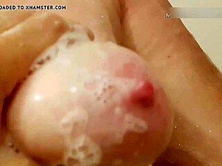 my 50 plus wife washes her natural tits and pussy in the shower.