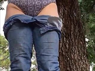 horny brunette babe shows ass in cute panty outdoor