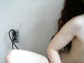 The petite teen amateur goes topless on webcam, exposing her pussy in public taboo show