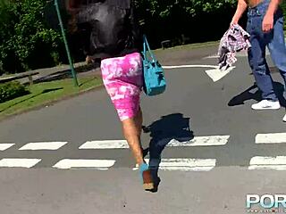 Redhead ebony goddess boldly pisses outdoors in public.