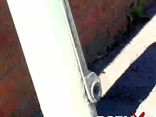 Redhead ebony goddess boldly pisses outdoors in public.