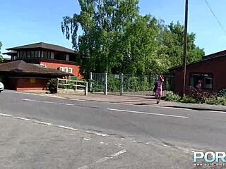 Redhead ebony goddess boldly pisses outdoors in public.