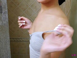 Tiny brunette enjoys a steamy hot shower