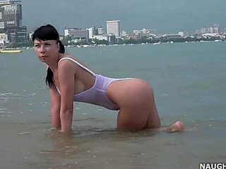 white one-piece swimsuit turns transparent when wet outdoors.