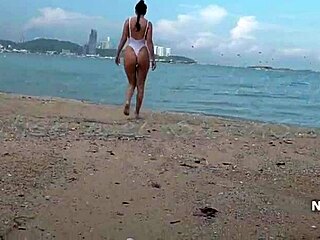 white one-piece swimsuit turns transparent when wet outdoors.