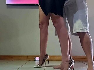 amateur couple fucks hard in kitchen, her dress lifted, ass bent over, tits bouncing, moaning to orgasm