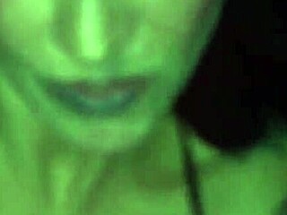 Inked up beauty gives a blowjob to a random man in a video booth