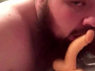 Young guy playfully sucks and rides his favorite toy in fun