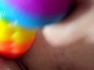 Rainbow dildo used in anal play