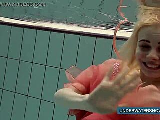 Katya Okuneva Stuns in Red Dress by the Pool. Her Solo Show Heats Up Outdoors.