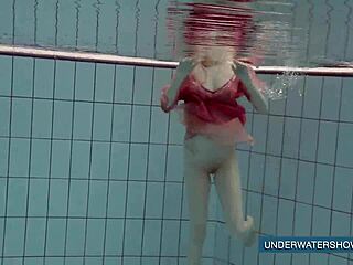 Katya Okuneva Stuns in Red Dress by the Pool. Her Solo Show Heats Up Outdoors.