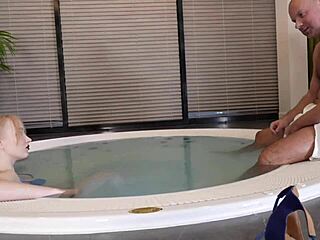 Hot young beauty with big tits gags on old man's huge cock in jacuzzi part 1