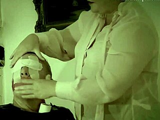 Dominatrix Mistress April commands restrained slave in bondage.