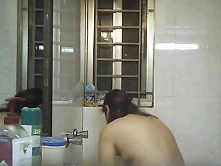 Watching an Indian beauty bathe in secret shower footage
