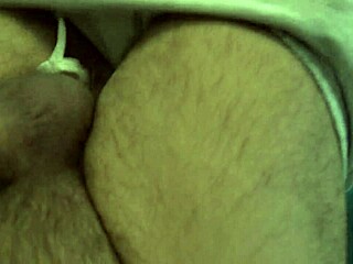 Hairy Amateur Stepmom Gives Handjob to 18-Year-Old Stepson in Bedroom, Making Him Cum