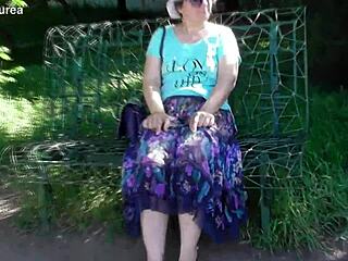 hairy mature woman in a see-through dress outdoors