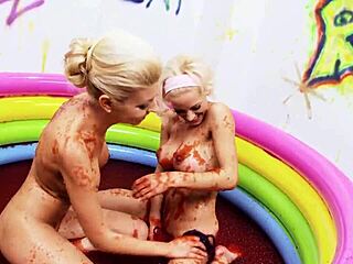 slippery wet lesbians finger each other in a jello-filled pool