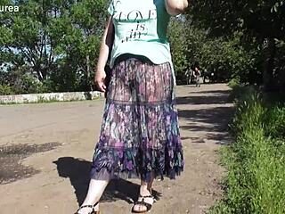 hairy mature woman in a see-through dress outdoors