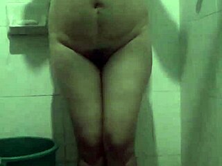 Aurora Boreal continues her relaxing shower in the bathroom.