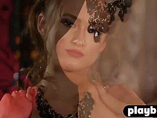 Hey, check out this busty brunette in her sexy costume before she strips