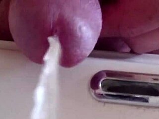 Pissing in the sink with closeup