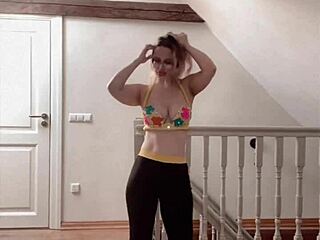 Belly dancer goddess with glasses sways to seductive music rhythmically