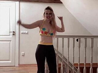 Belly dancer goddess with glasses sways to seductive music rhythmically