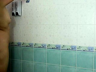 Bathing and teasing her pussy while waiting for him