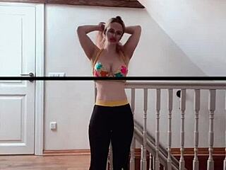 Belly dancer goddess with glasses sways to seductive music rhythmically