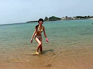 Skinny Japanese chick enjoys having a photoshoot on the beach