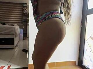 Latina with big ass dancing seductively in tight outfit