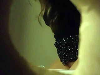 Hidden cam catches sexy babe in white panties peeing through wall hole