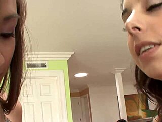 Enticing Lesbian Ladies in Pink Laundry Play with Colorful Dildo Toy