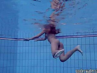 Lucy teasingly takes off her bikini in the pool