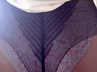 Elza Kom explores nylon tights fetish in bedroom setting