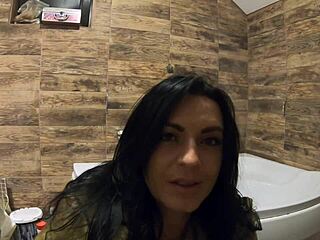 Milfy Calla engages in pee play in bathtub, wearing fur coat and pantyhose, with jerk off instructions