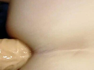 girl fucks guy's ass with strapon in intense anal session, making him moan loudly