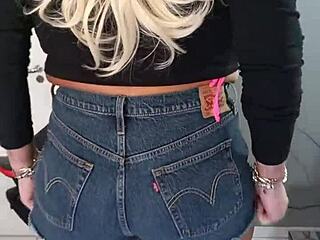 Beautiful tanned woman wearing sexy shorts with tan lines