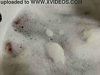 Brunette milf sings naked in bath, revealing hairy pussy