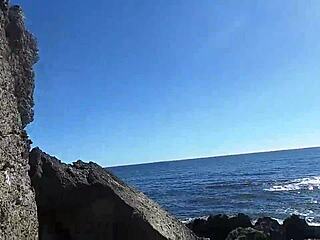 On the sunny beach, an African nudist prostitute flaunts her firm ass while teasing passersby seductively.