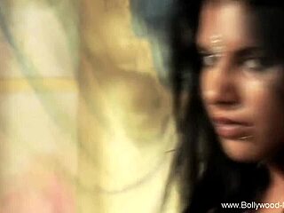 Sensual brunette Asian dancer teases with erotic moves and softcore charm.