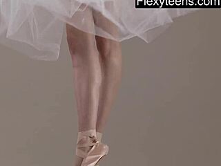 Blonde Russian gymnast demonstrates flexible acrobatic stretching in gym workout routine