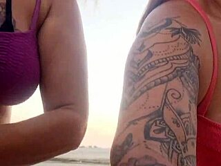 Chatting sexy on beach with naughty friend