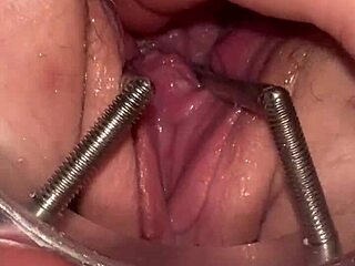 fist queen suggests extreme stretching with metal ring deep inside her wet pussy