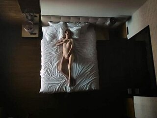 enjoying the best relaxing view as she pampers herself comfortably in her cozy bed at home